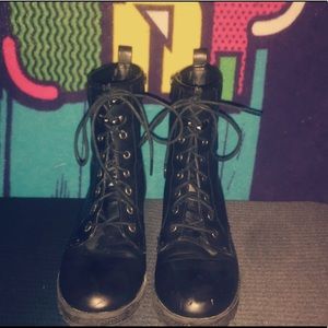 Black Zip up and lace boots.